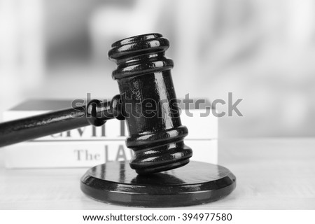 Wooden judges gavel on wooden table, close up. Retro stylization