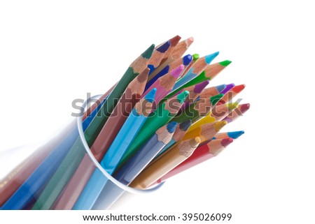 Pencil in glass on white background, photo, lot of colors