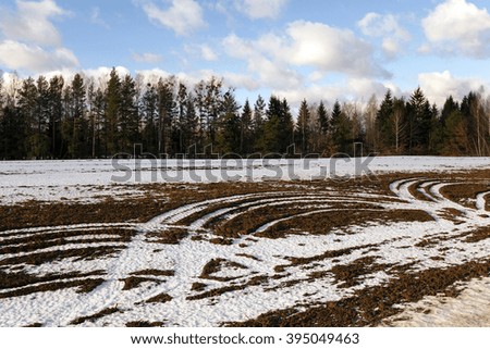   covered with white snow (snow-covered) field in winter