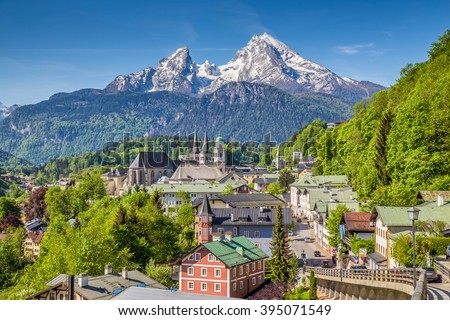 Historic town of Berchtesgaden with famous Watzmann mountain in the background on a sunny day with blue sky and clouds in springtime, Nationalpark Berchtesgadener Land, Upper Bavaria, Germany Royalty-Free Stock Photo #395071549