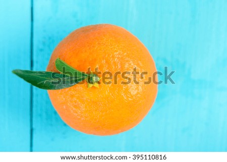 Fresh Tangerine On Blue Table