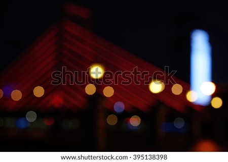 Artistic style - Defocused urban abstract texture bokeh city lights in the background with blurring lights for your design, vintage or retro color toned