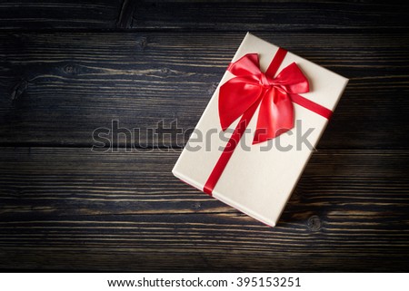 hand made gift box on the old textured wood background with place for text