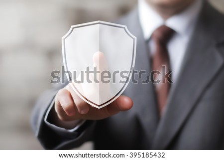 Businessman pushing icon button with shield security virus
