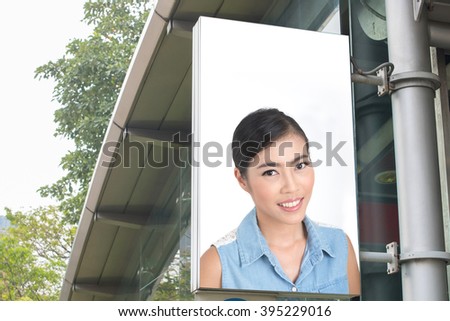 billboard with picture of business woman
