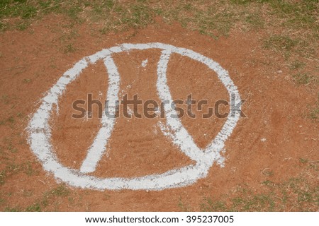 Baseball drawn in chalk on the field.