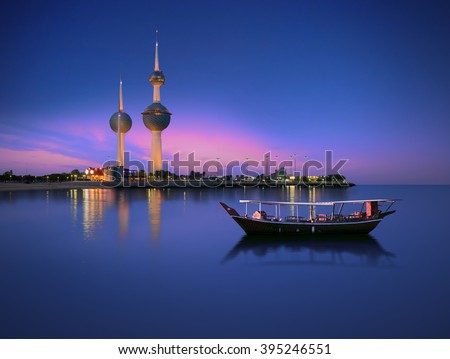Arabian passenger boat during blue hour next to kuwait tower  Royalty-Free Stock Photo #395246551