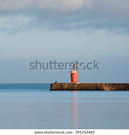 Old waterbreak with lighthouse
