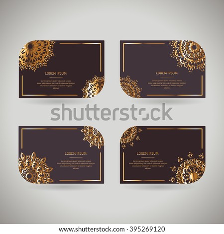 Set of four ornamental gold cards with flower oriental mandala on dark background. Ethnic vintage pattern. Indian, asian, arabic, islamic, ottoman motif. Vector illustration under clipping mask.