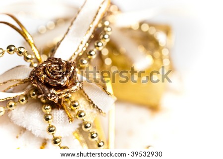 Beautiful golden gift on a over white background