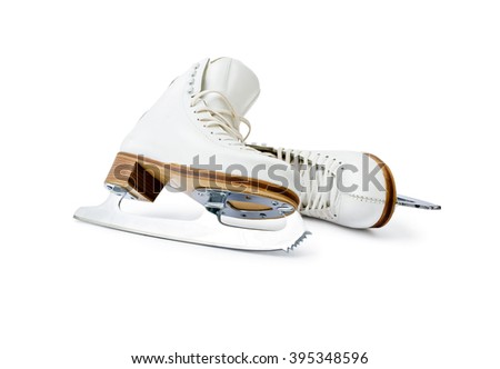 Figure ice skates. Pair of professional skates for figure ice skating leaning each other close up isolated on white background.