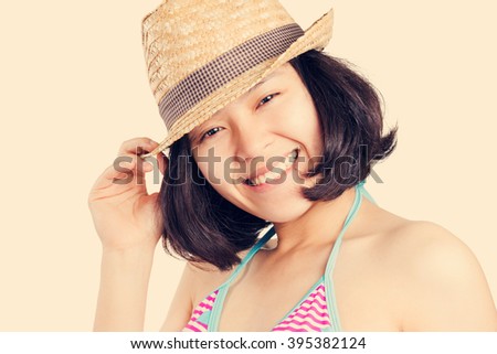 Asian woman with smiley face wearing hat.grunge vintage style.