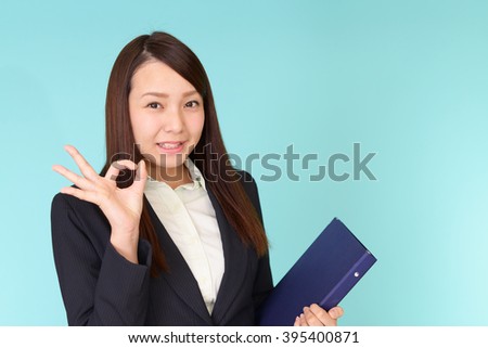 Business woman with ok hand sign