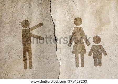 Symbols of men and women with a child pulling hands towards each other against the background of a concrete wall divided by cracks. Toned