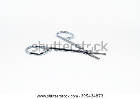 open cuticle scissors isolated on white background.Cuticle scissor are small scissor used for trimming the dead skin around the base of the nail bed.