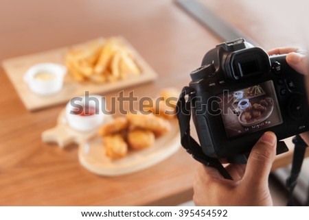 DSLR camera take a photo food at cafe