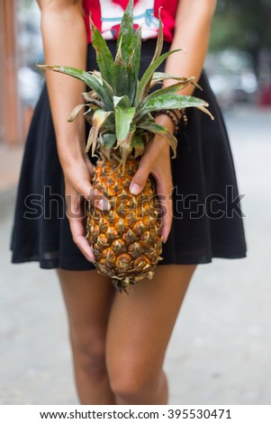 girl with pineapple in hand summer fruit