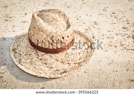 Straw hat on a tropical beach, Close up image