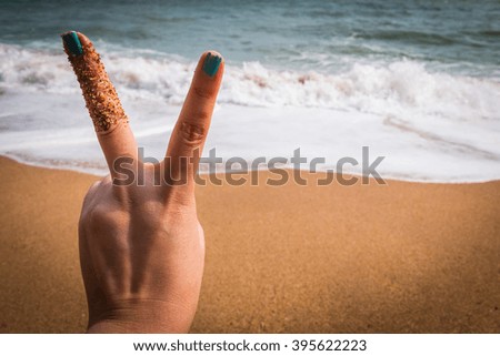 Two  fingers at the see for background