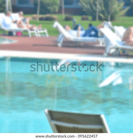 The pool in the luxury hotel; defocused background intentionally with blurred effect; cute square photo intentionally.