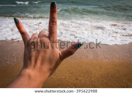 Hand in love you for background at the sea