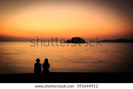 silhouette couple at the twilight sea beach