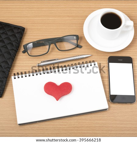 office desk : coffee with phone,notepad,eyeglasses,wallet,heart on wood background