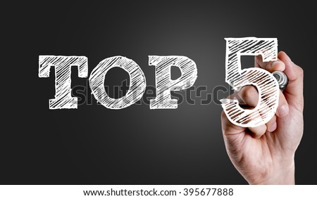 Hand writing the text: Top 5 Royalty-Free Stock Photo #395677888