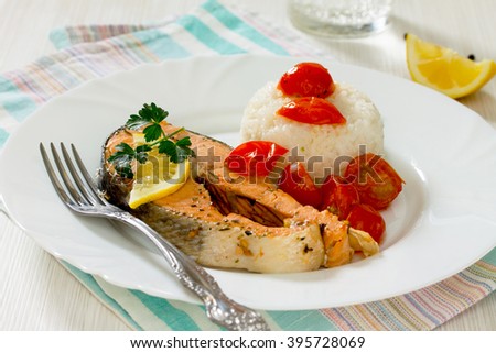Salmon steak with tomato sauce, selective focus