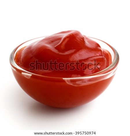 Small glass condiment bowl of red tomato sauce ketchup. Isolated on white in perspective. Royalty-Free Stock Photo #395750974