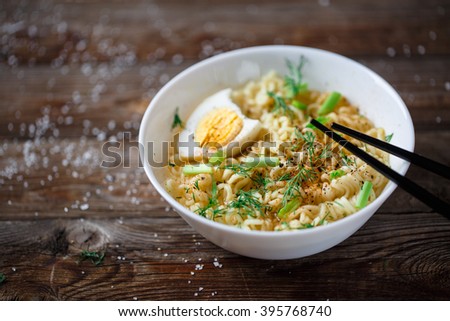 Asian noodles with fresh green onion and boiled egg
