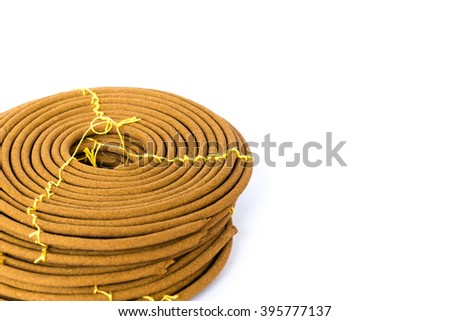 Stack of round incense or citronella spiral coil isolated on white. Made from pure ingredients, natural glue with long burn time. It has mild and long lasting fragrance. Meditation and worship concept