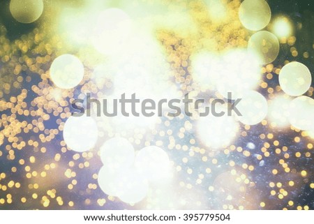 glitter vintage lights background. light silver, gold, blue and black. de focused