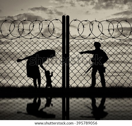 Concept of the refugees. Silhouette refugee mother with a baby and a border guard at sunset and reflection