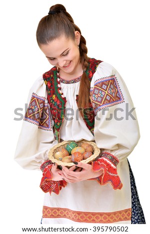 Slovakian folklore girl with easter egg. Happy easter.