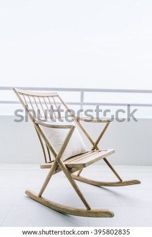 Empty rocking chair decoration in outdoor patio deck - Vintage Light Filter