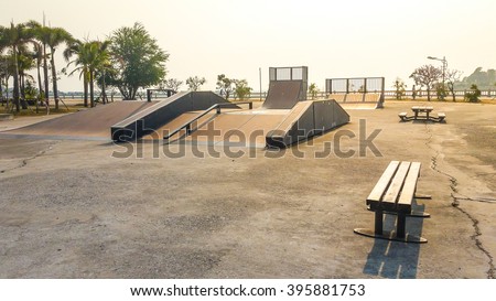 Skate Park in the daytime. Customizable dark tones . Royalty-Free Stock Photo #395881753