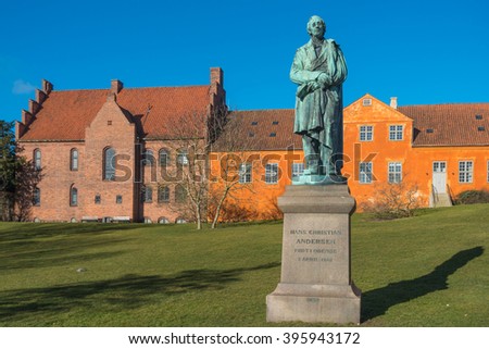 Hans Christian Andersen statue near the river in Odense, Dernmark Royalty-Free Stock Photo #395943172
