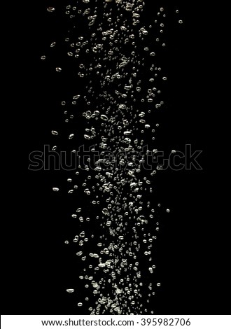 Close up of air bubbles in the water isolated on black background
