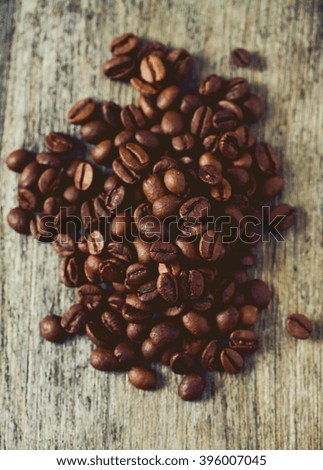 coffee beans on wooden surface