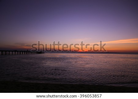 The landscape photography of orange sun setting into the ocean in the sea on Koh Samui, Surat Thani, Thailand.