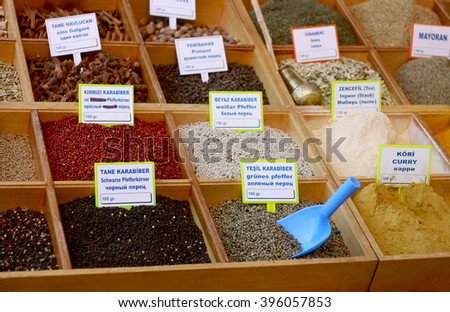 Sale of spices market in Turkey. The price tags on each product with the title. In the center of the bottom of the blue plastic paddle for sprinkling spices.