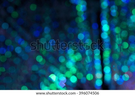 Abstract row of green and blue lights bokeh background