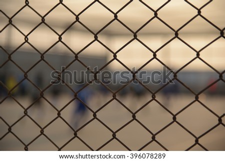Soft focus , Football field with fence , Fence evening.