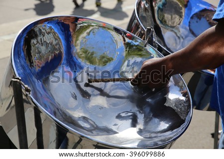Steel pan drum player with sticks Royalty-Free Stock Photo #396099886