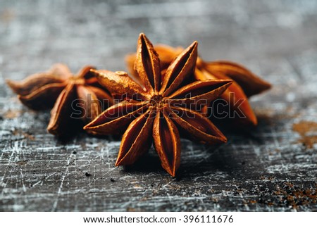 Food Background with Close-up of Star Anise on Vintage Black Table. Selective Focus.  Royalty-Free Stock Photo #396111676