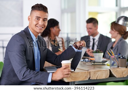 team of successful business people having a meeting in executive sunlit office