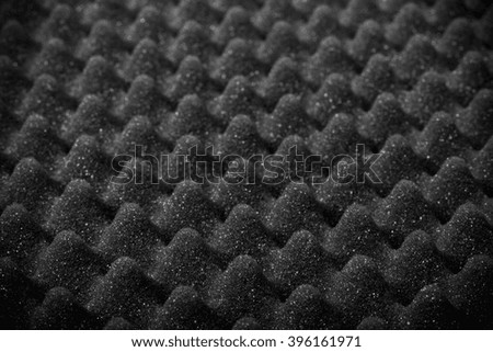 The texture of the sponge with embossed surface for background. Selective focus. Shallow depth of field. Toned.