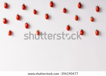 Cherry tomatoes pattern on white background. Flat lay.