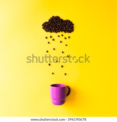 Coffee beans in shape of rainy cloud with purple cup on yellow background. Weather concept.